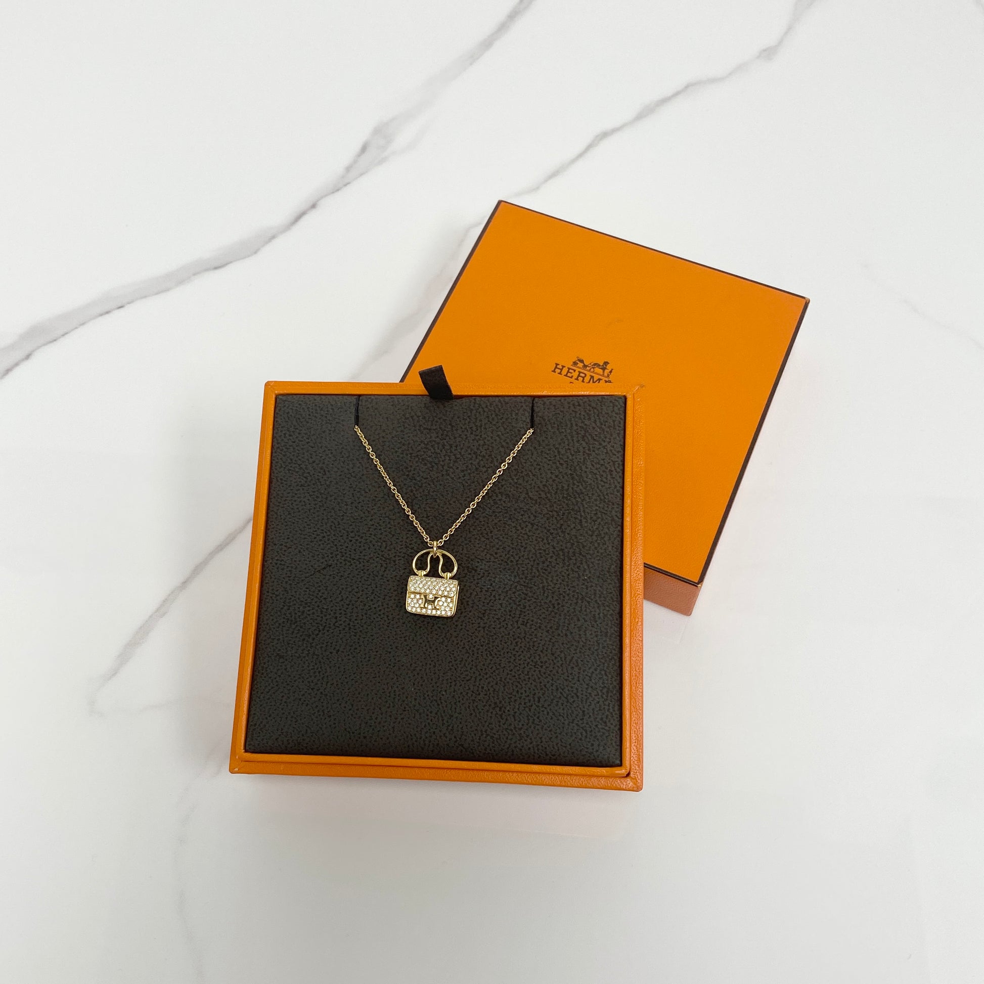 Hermès Constance Pendant - Lafayette Consignment